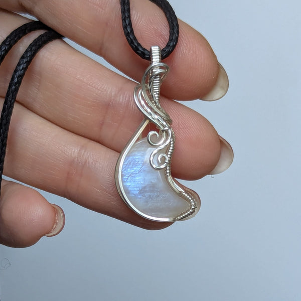 Rainbow Moonstone Crescent Wire Wrapped Pendant in Sterling Silver