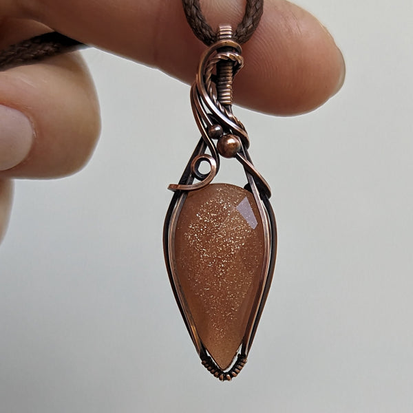 Faceted Sparkly Peach Moonstone Wire Wrapped Oxidized Copper Pendant