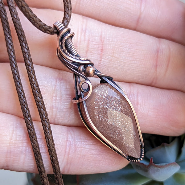 Faceted Sparkly Peach Moonstone Wire Wrapped Oxidized Copper Pendant