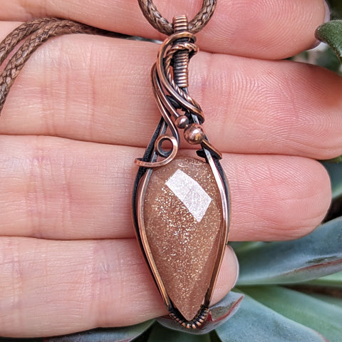 Faceted Sparkly Peach Moonstone Wire Wrapped Oxidized Copper Pendant