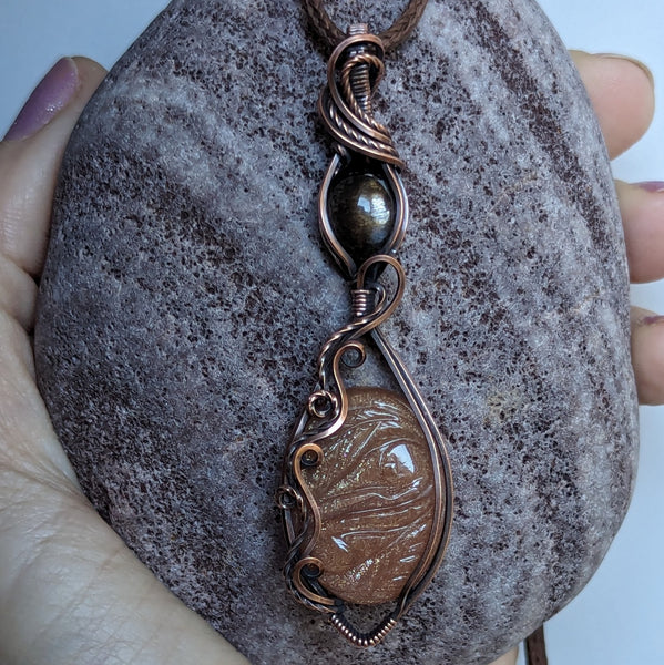 Carved Sunstone & Black Sunstone Wire Wrapped Pendant in Oxidized Copper