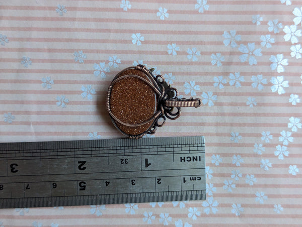 Goldstone Pumpkin Wire Wrapped Pendant in Oxidized Copper