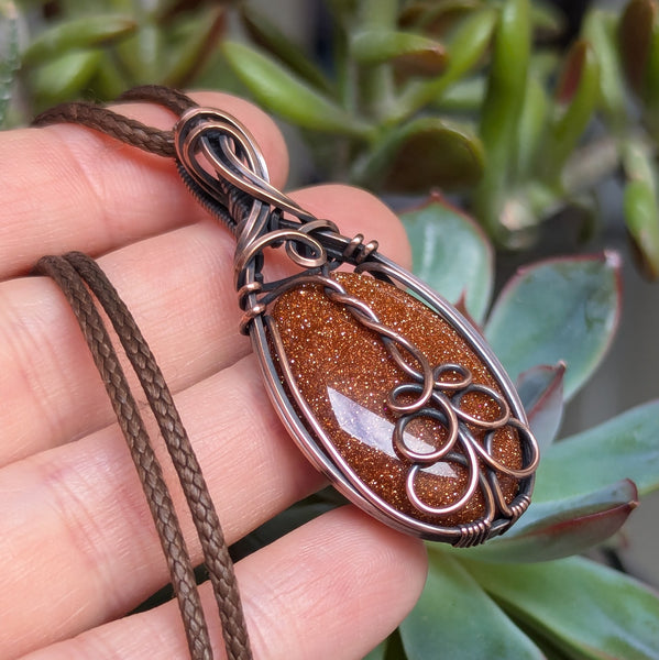 Goldstone Wire Wrapped Oxidized Copper Pendant