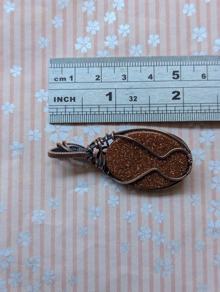 Goldstone Wire Wrapped Oxidized Copper Pendant