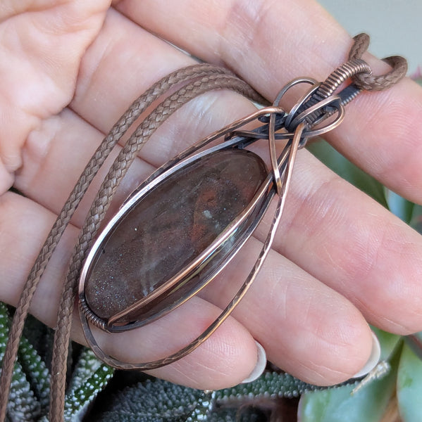 Red Sunstone Wire Wrapped Pendant in Oxidized Copper