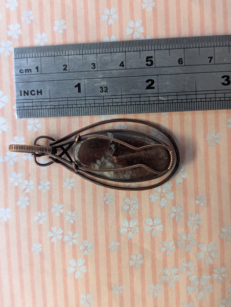 Red Sunstone Wire Wrapped Pendant in Oxidized Copper