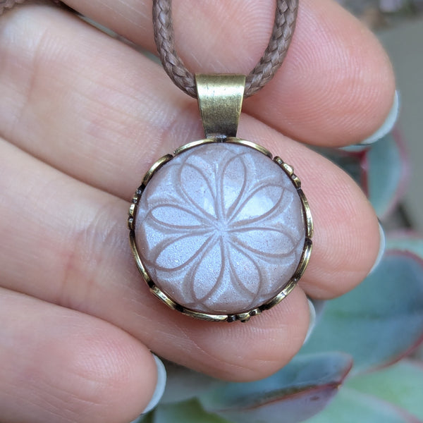 Carved Peach Moonstone Pendant in Antique Brass