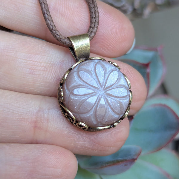 Carved Peach Moonstone Pendant in Antique Brass